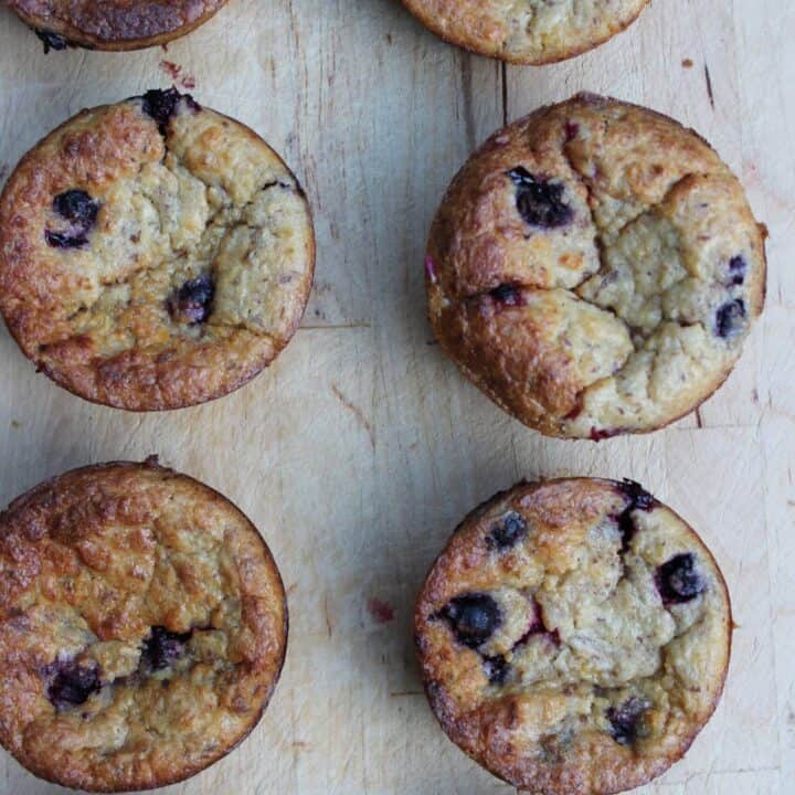 Blueberry Banana Oatmeal Muffins on a wooden cutting board