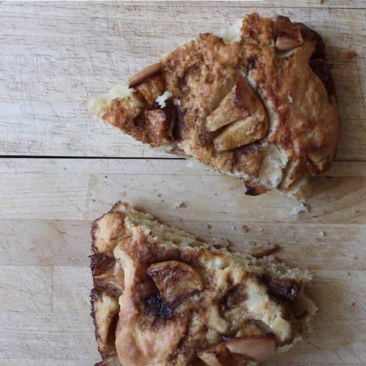 An overhead shot of two slices of homemade sourdough discard apple cake.