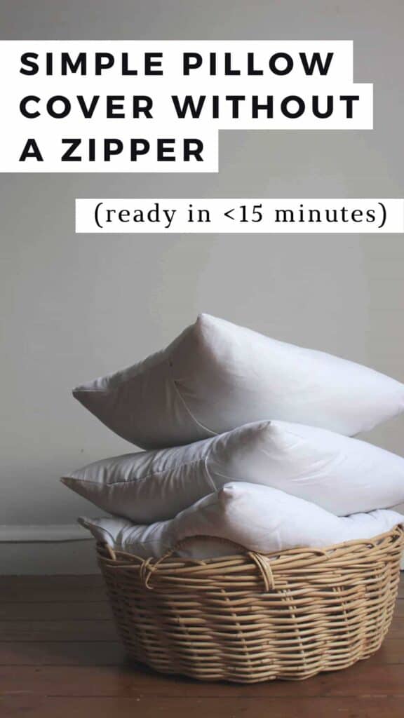 Three white pillows stacked in a wooden basket.