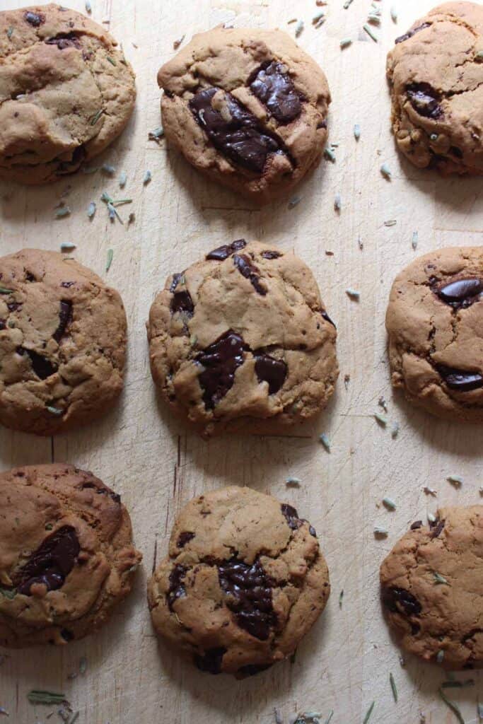 Lavender Chocolate Chip Cookies on a wooden cutting board.