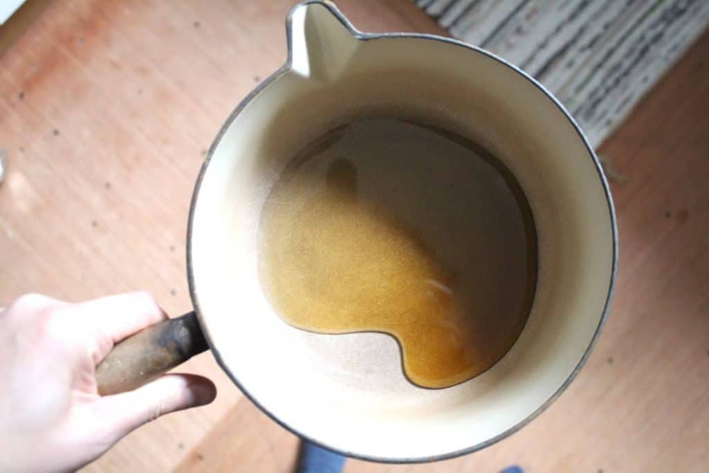 An overhead shot of maple syrup in a saucepan.